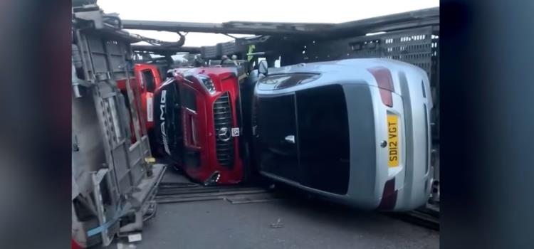 Supercar transporter flips over!