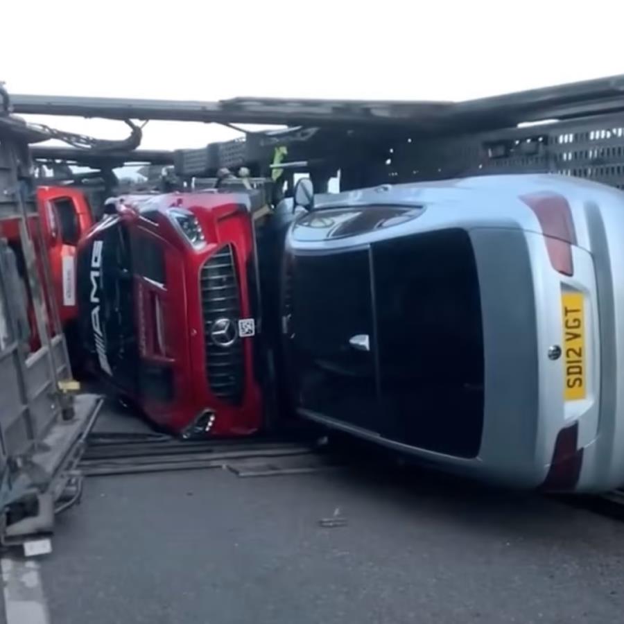 Supercar transporter flips over!